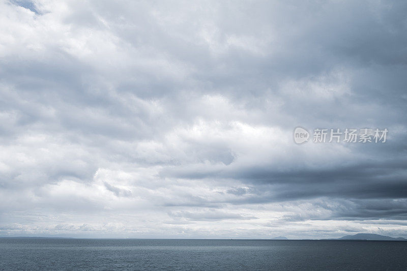 Moody Cloudscape Over The Ocean